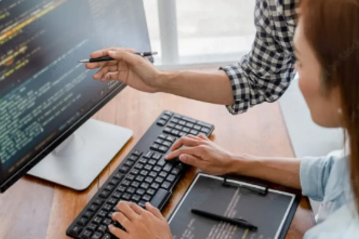 person typing at a computer