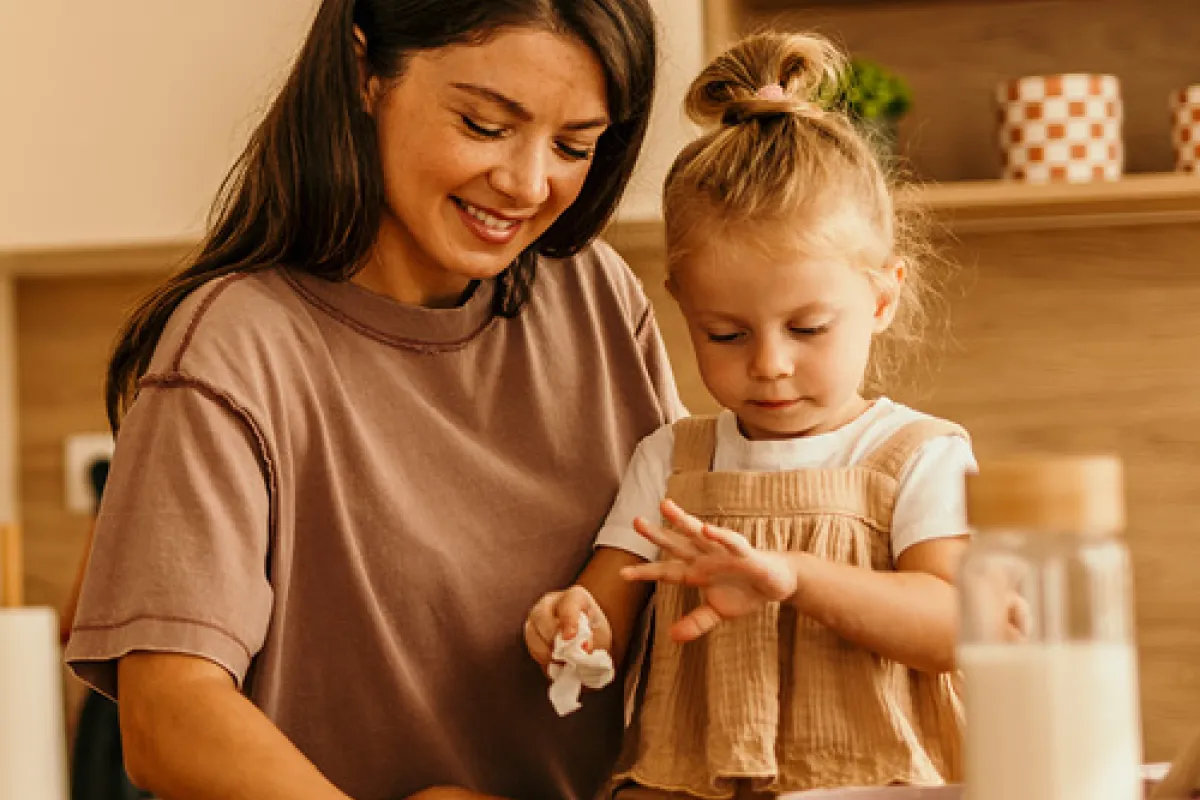 Mother and child in kitchen.
